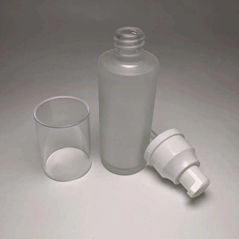Must Have Cosmetic Skincare Packaging Empty 50ml Cylinder Shape Glass Bottle with White Plastic Pump Transparent Cap
